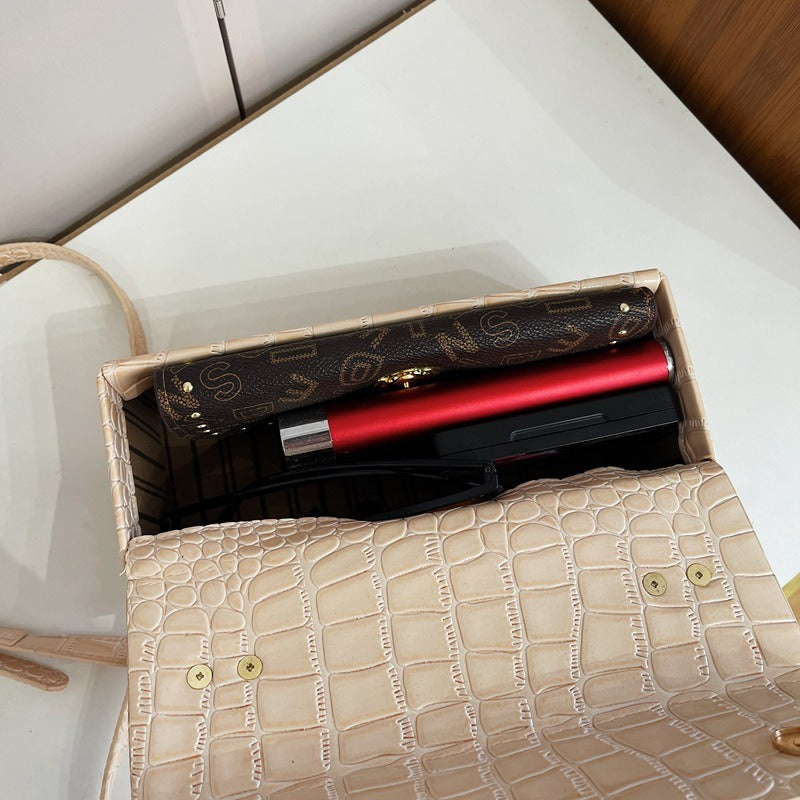 Sac à bandoulière polyvalent en cuir laqué