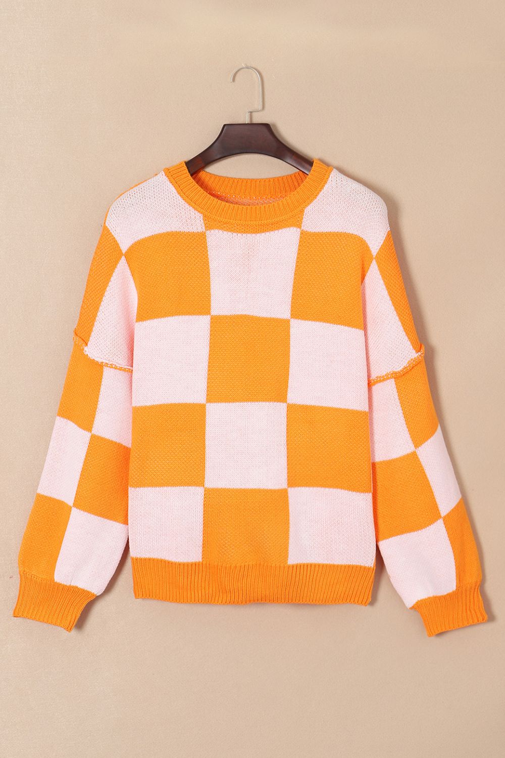 Pull à carreaux avec coutures apparentes et épaules tombantes