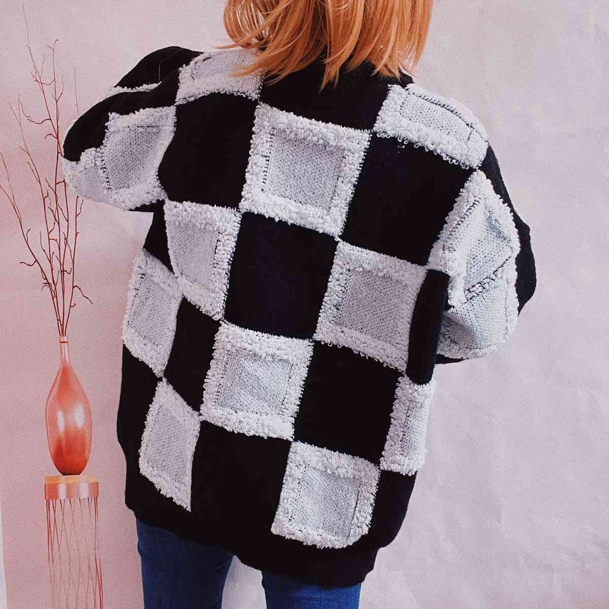 Pull à carreaux à col rond et manches longues