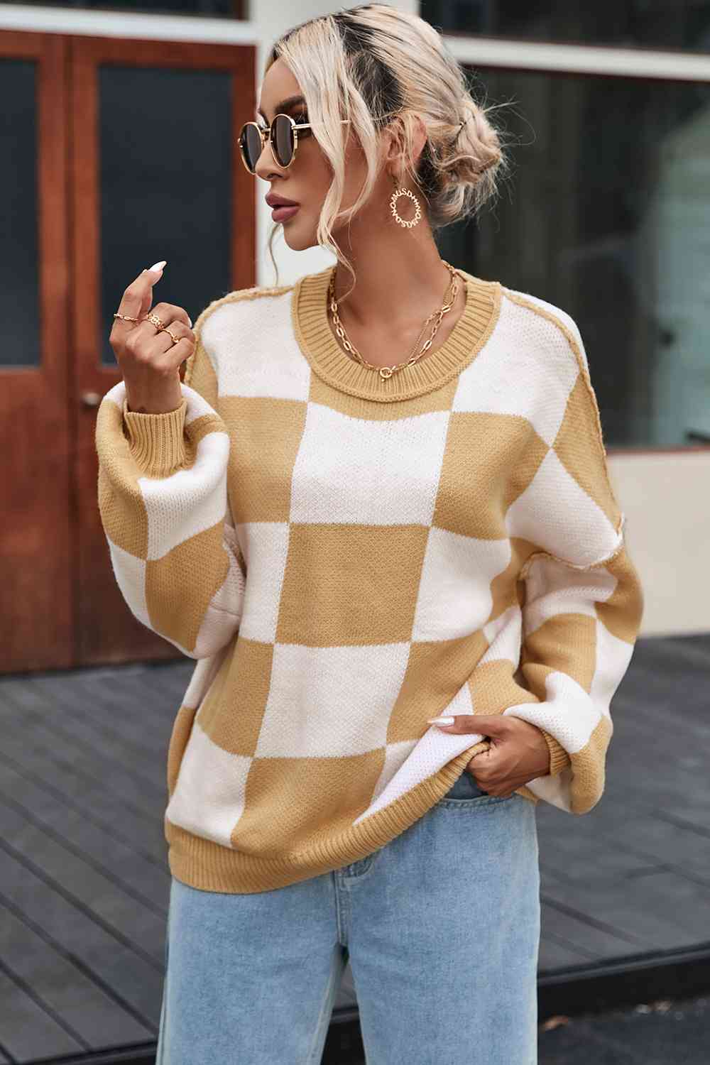 Pull à carreaux avec coutures apparentes et épaules tombantes