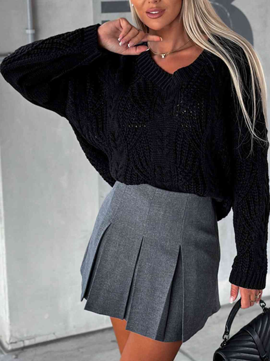 Pull à manches longues en maille torsadée et col en V