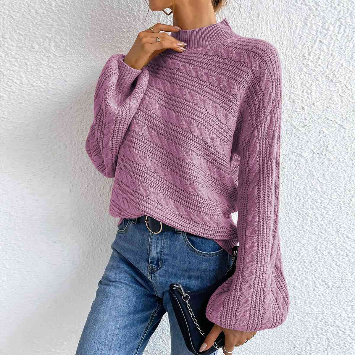 Pull à manches longues et col montant en maille torsadée