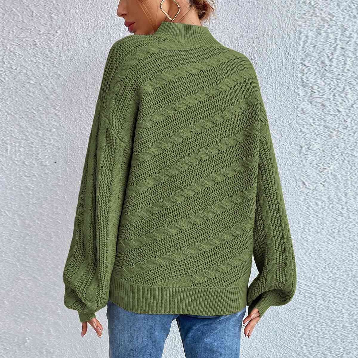 Pull à manches longues et col montant en maille torsadée