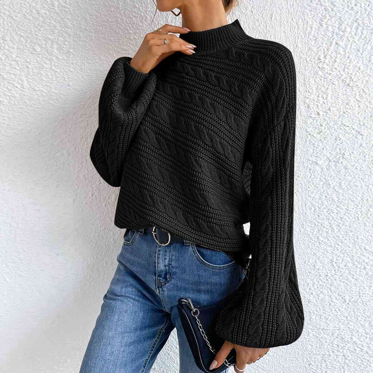 Pull à manches longues et col montant en maille torsadée
