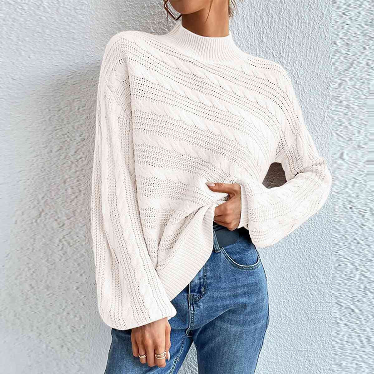 Pull à manches longues et col montant en maille torsadée