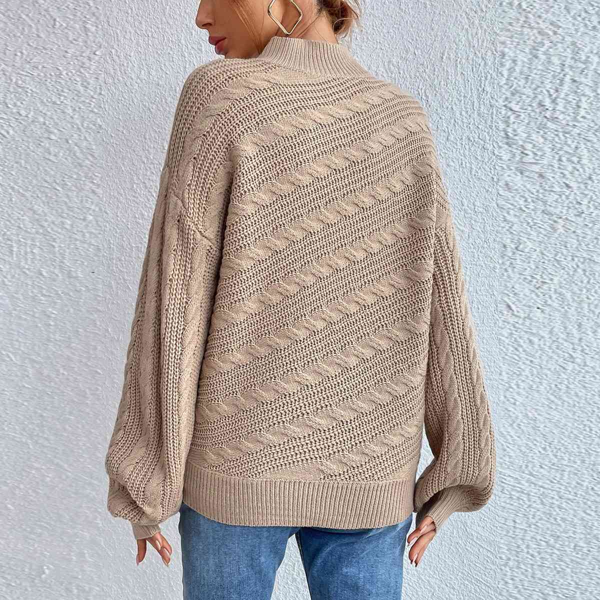 Pull à manches longues et col montant en maille torsadée