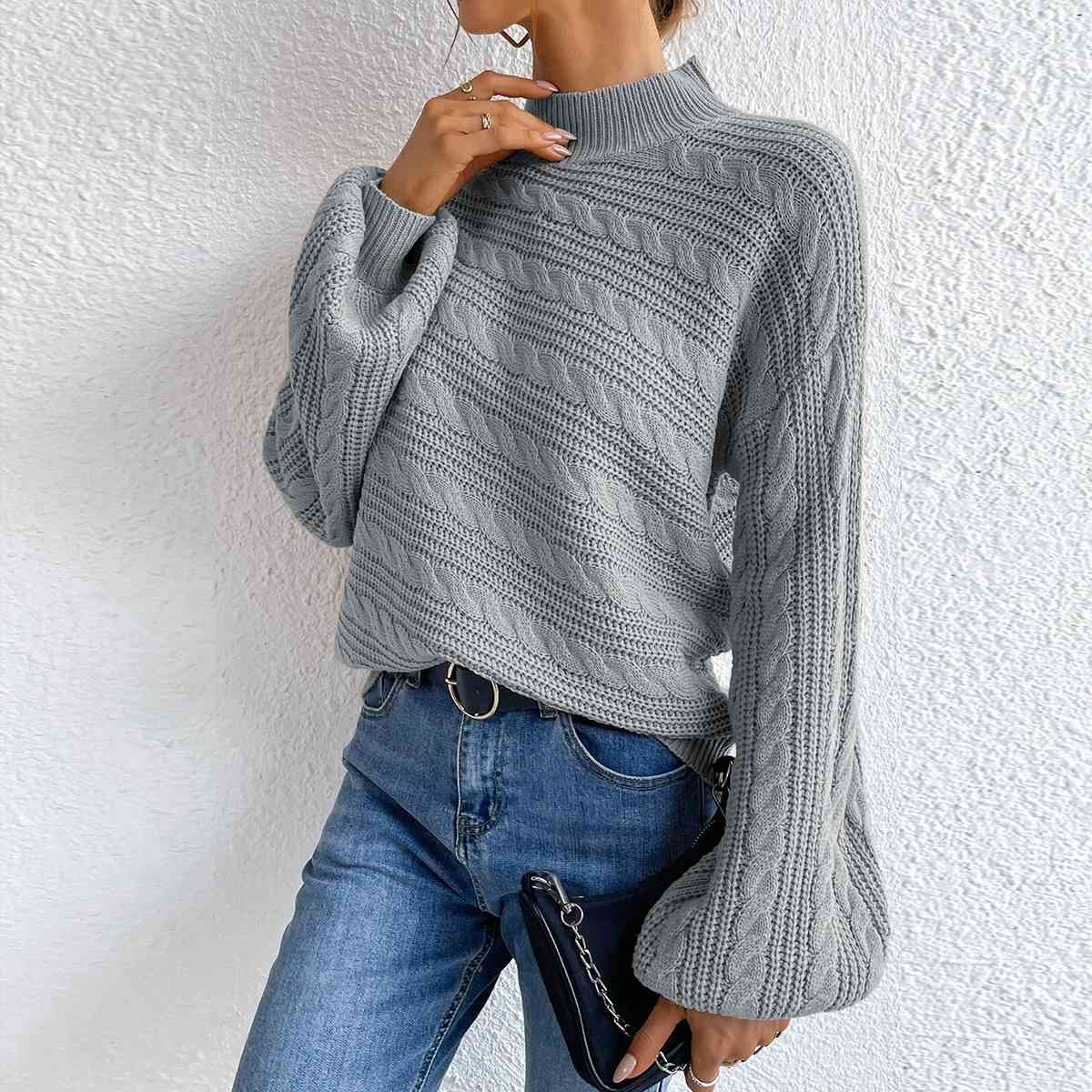 Pull à manches longues et col montant en maille torsadée