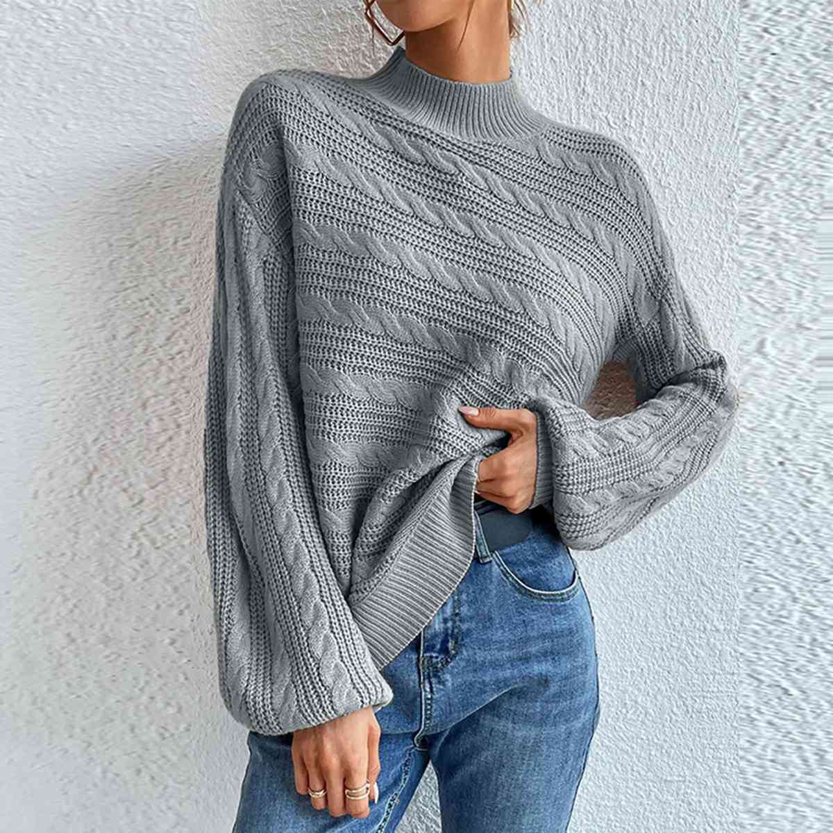 Pull à manches longues et col montant en maille torsadée