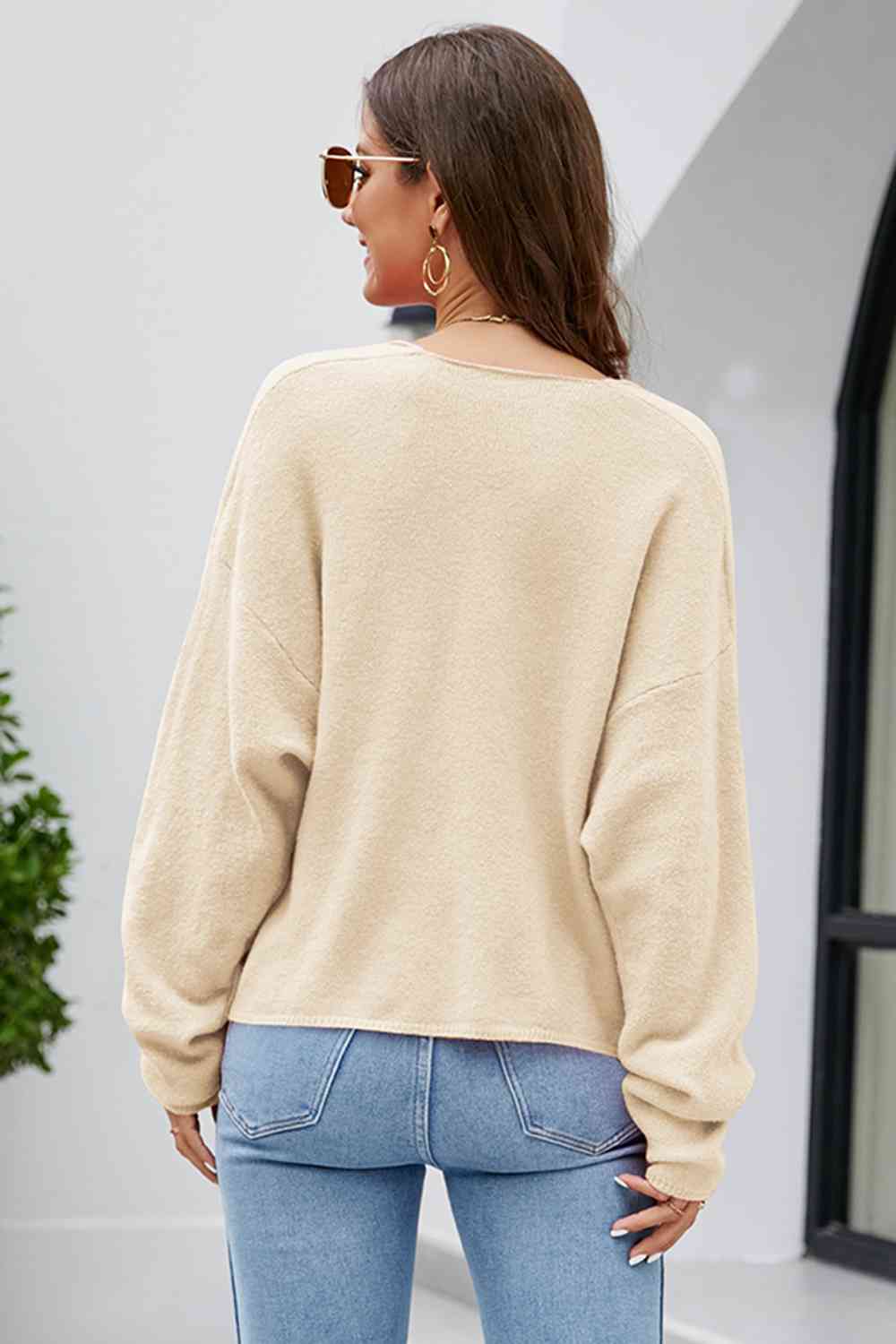 Haut en tricot à manches longues et col en V et épaules tombantes