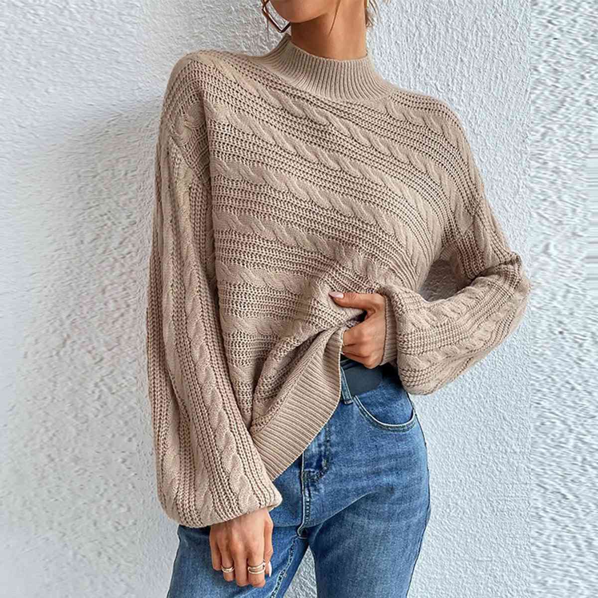 Pull à manches longues et col montant en maille torsadée
