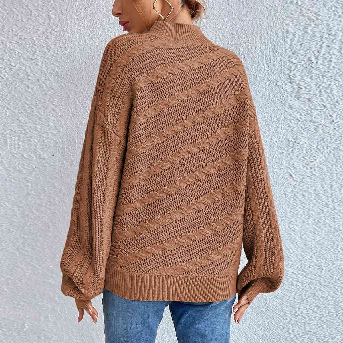 Pull à manches longues et col montant en maille torsadée