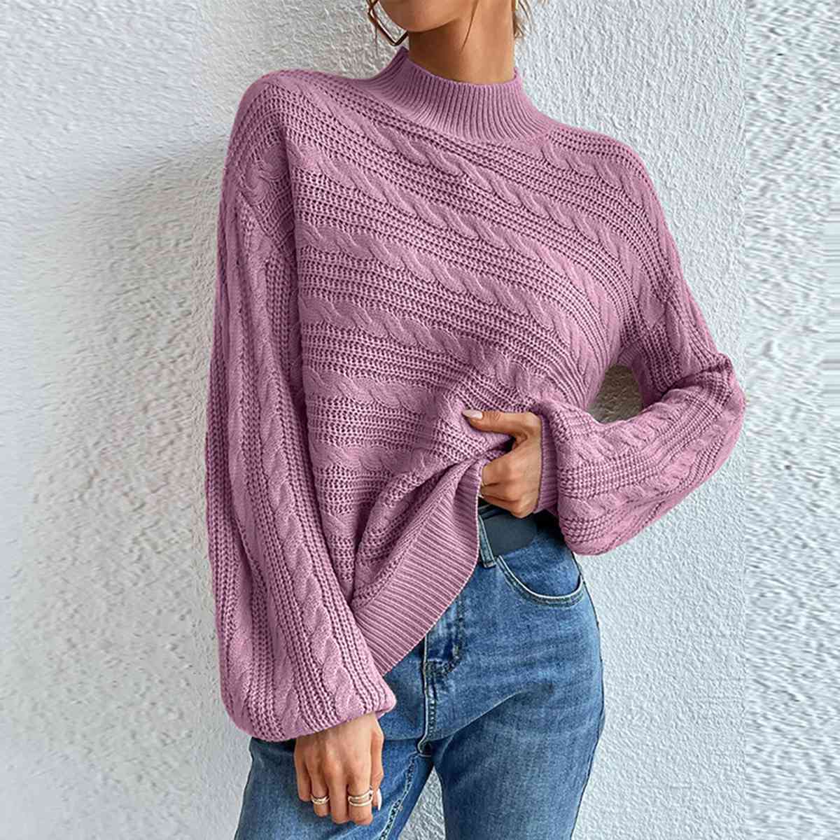 Pull à manches longues et col montant en maille torsadée