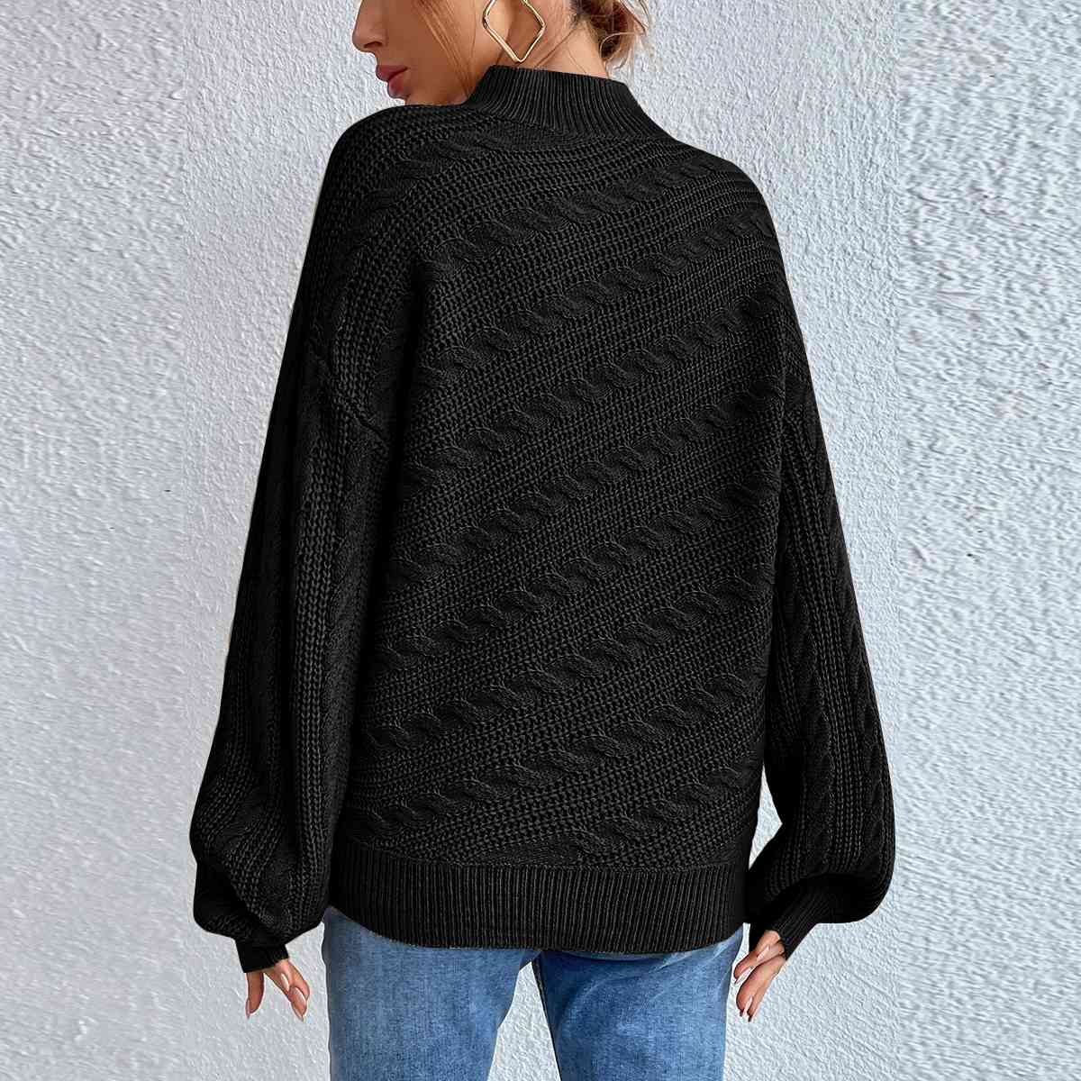 Pull à manches longues et col montant en maille torsadée