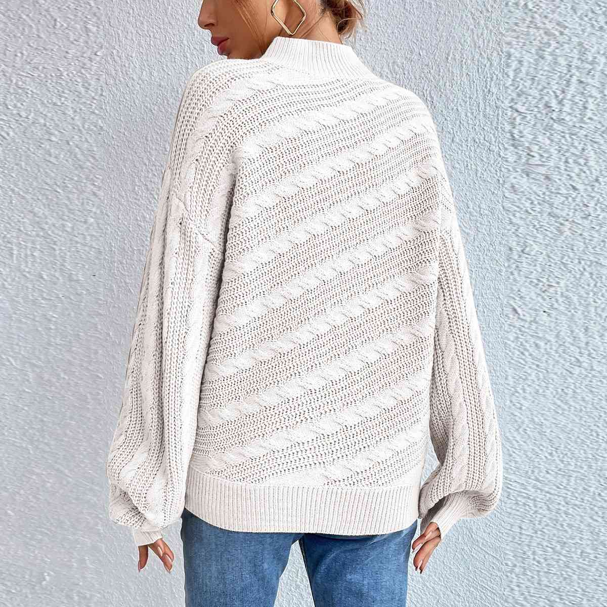 Pull à manches longues et col montant en maille torsadée