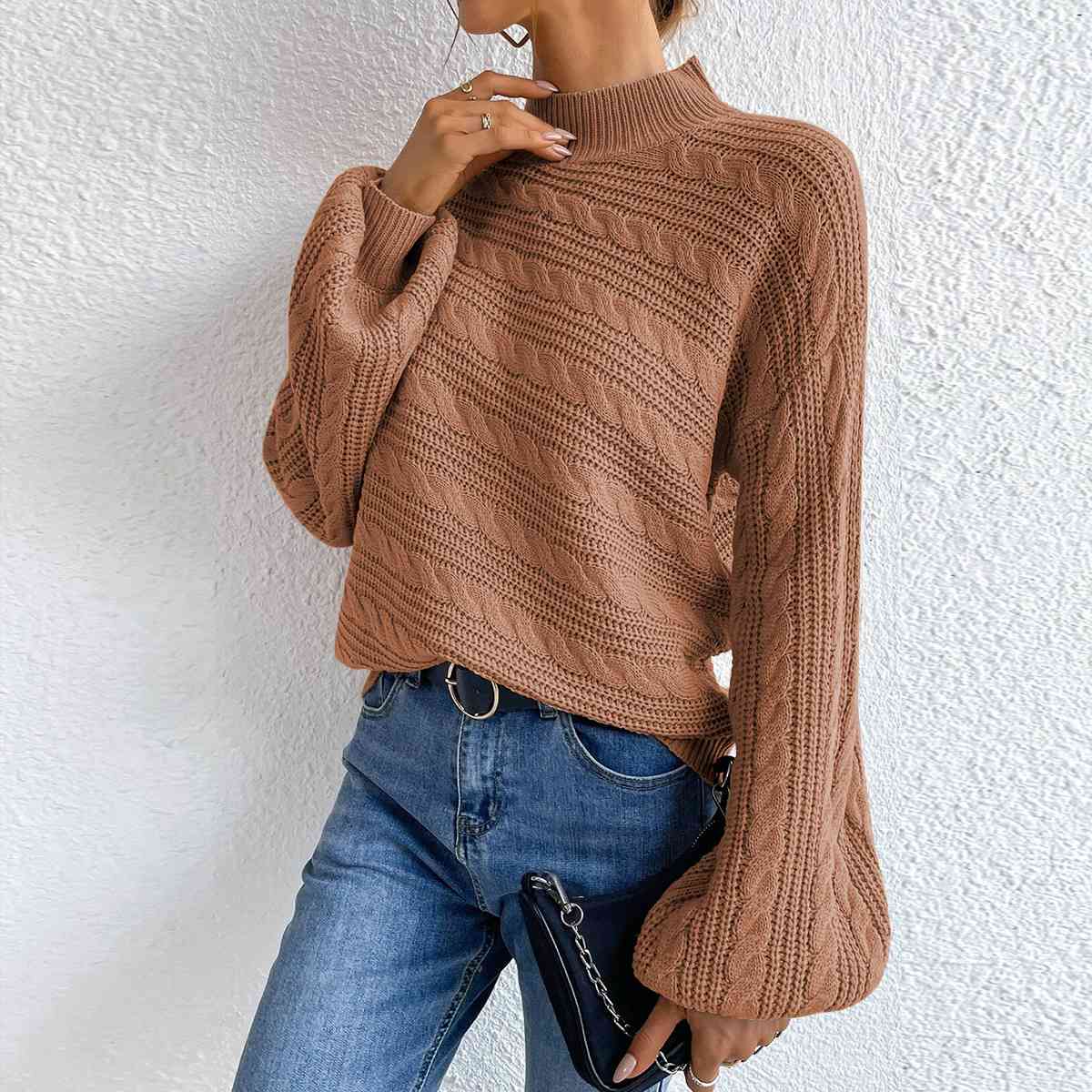 Pull à manches longues et col montant en maille torsadée
