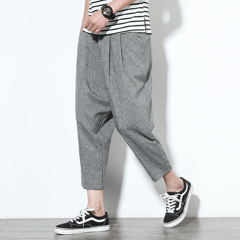 Cropped pleat-front trousers