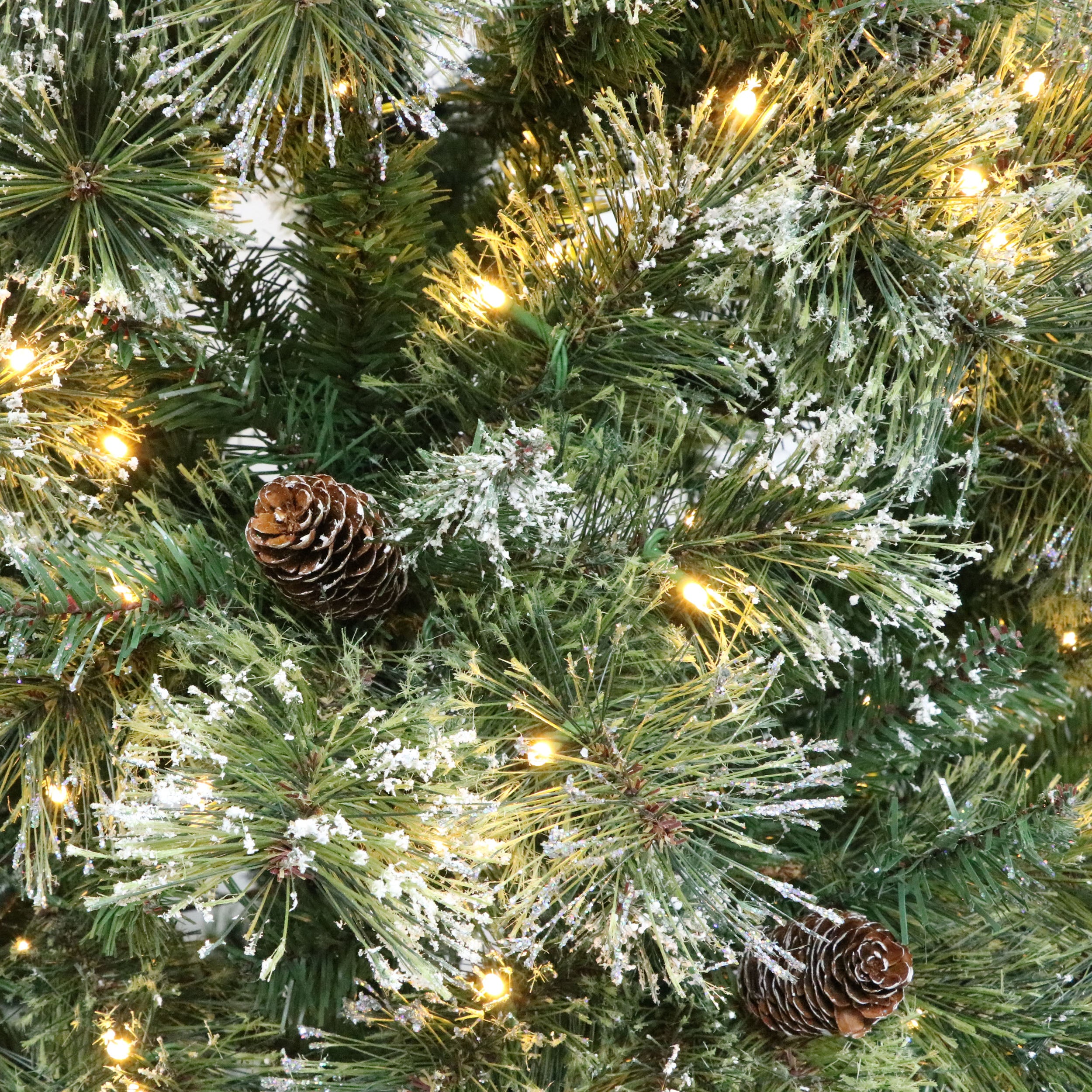 7' Brilste Mixed Hinged Tree with Snow and Glitter and 78 Frosted Pine Cones and 650 Clear LED Lights