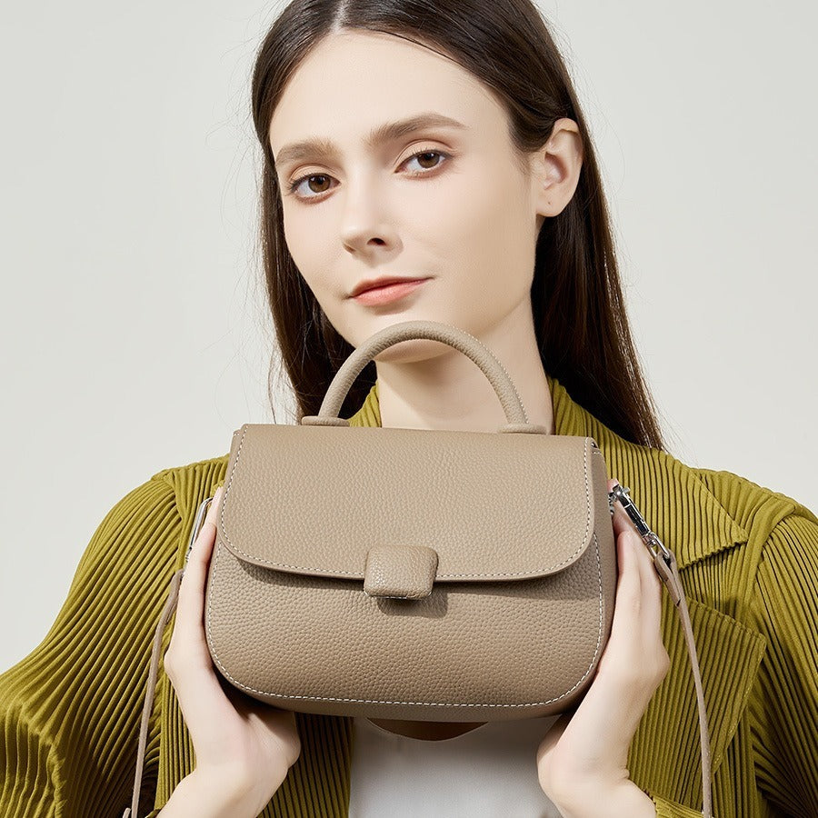 Pebbled top-handle flap bag