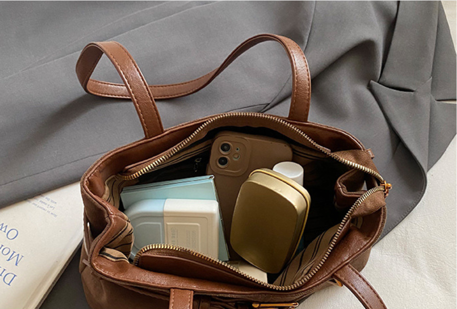 Belted baguette shoulder bag
