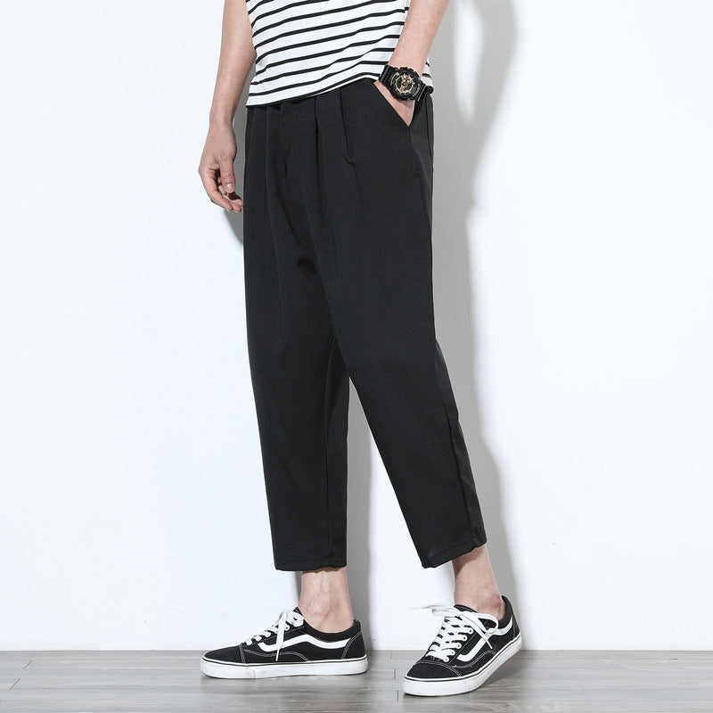 Cropped pleat-front trousers