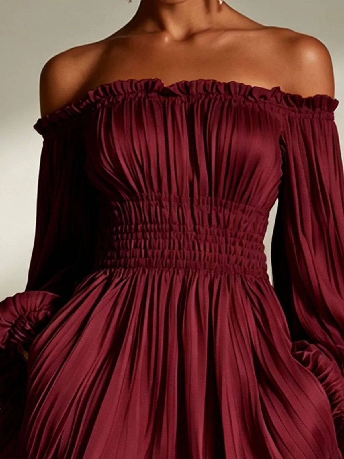 Off-shoulder pleated mini dress
