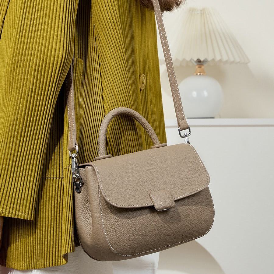 Pebbled top-handle flap bag