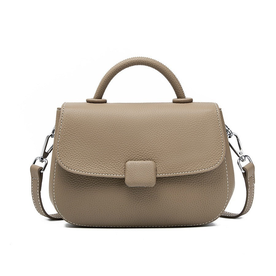 Pebbled top-handle flap bag