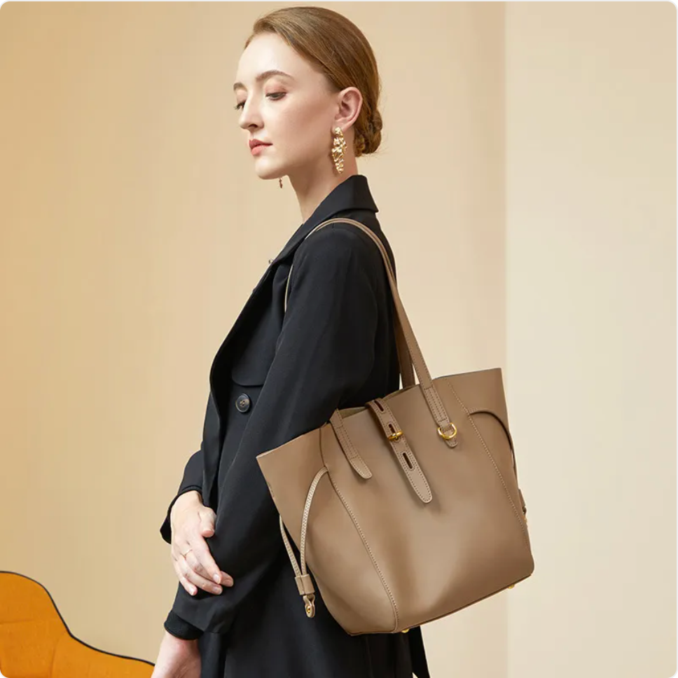 Side strap leather tote, Taupe, on model, side view