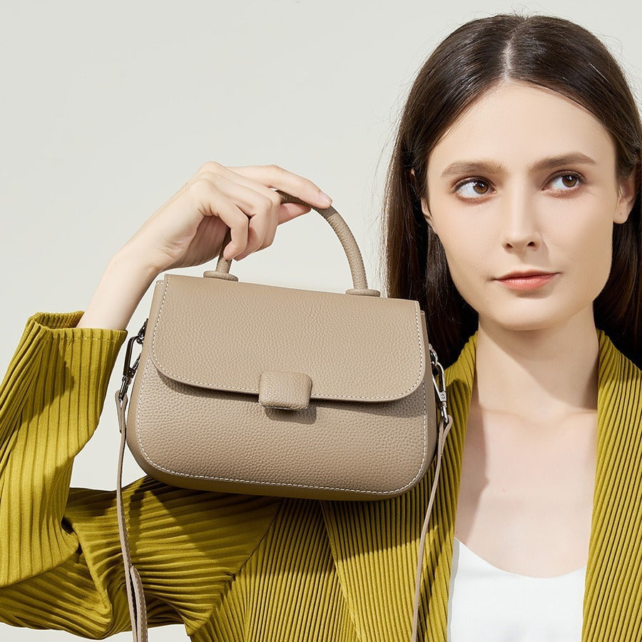 Pebbled top-handle flap bag