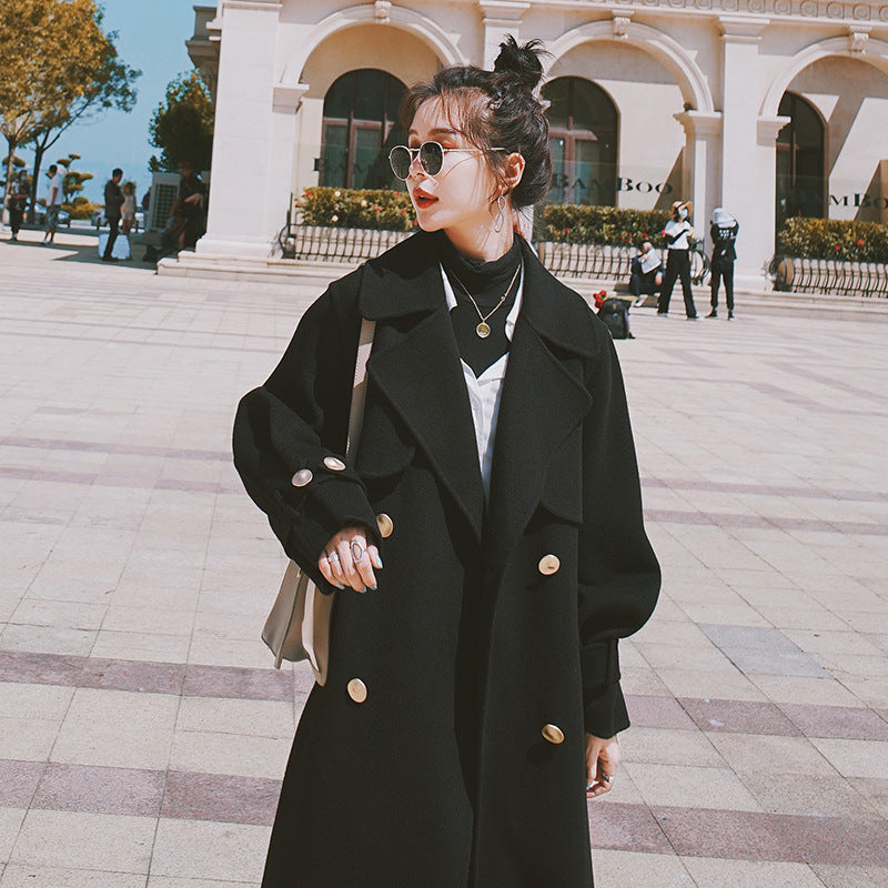 Belted black wool coat