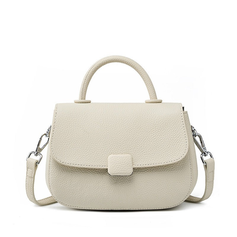 Pebbled top-handle flap bag