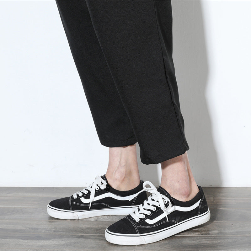 Cropped pleat-front trousers