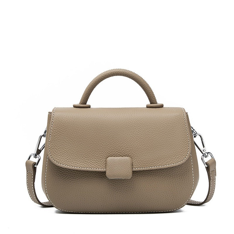 Pebbled top-handle flap bag