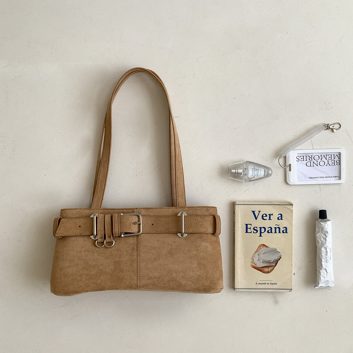 Belted baguette shoulder bag