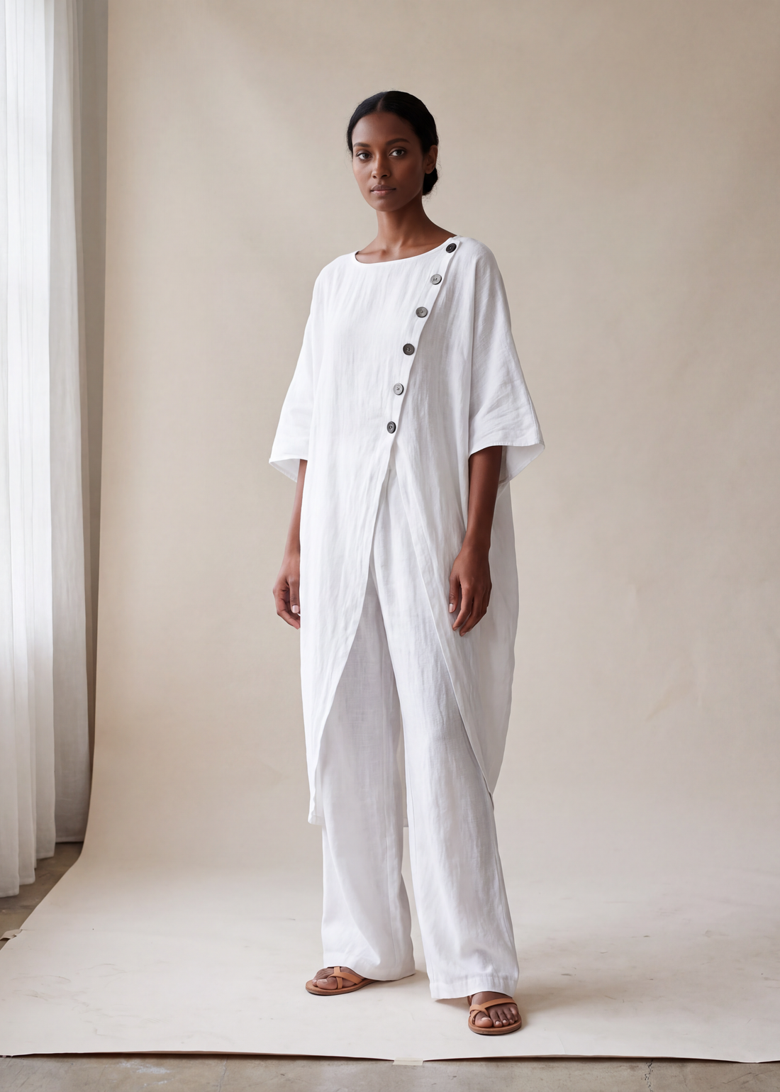 Asymmetric shirt and wide leg trouser set, White, worn full length in the studio