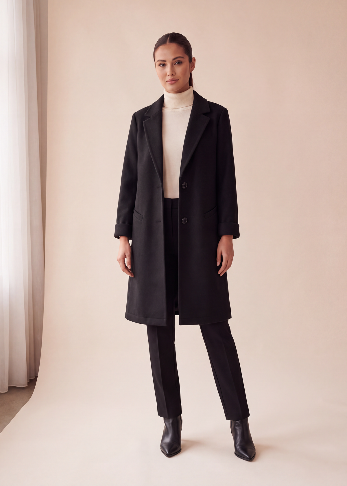 Lapel button coat, Black, worn full length in the studio