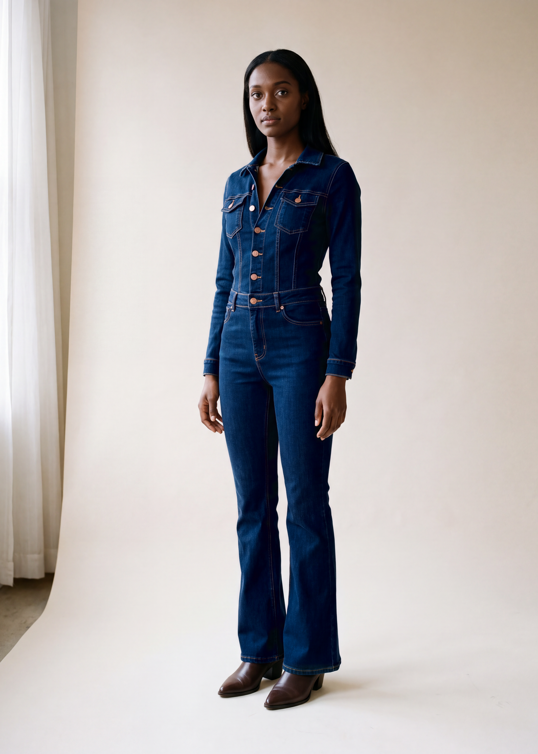 Flared denim jumpsuit, Dark blue, worn full length in the studio